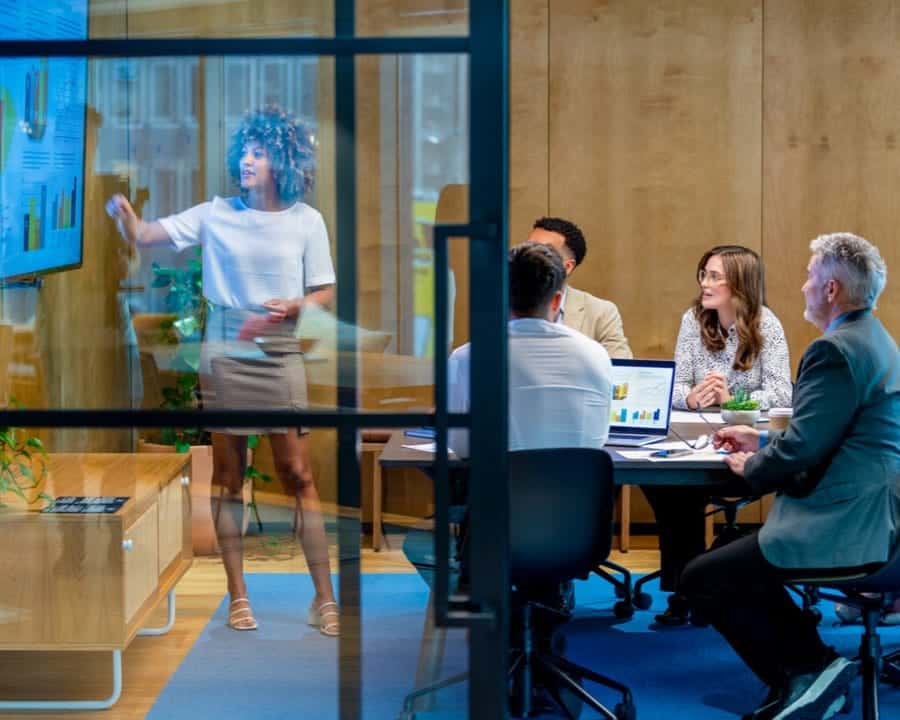 Business woman giving presentation in office environment