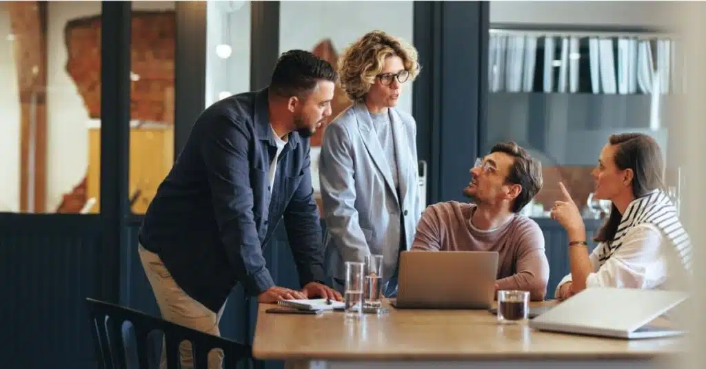 Business people having a meeting in a digital marketing agency. They are discussing a project in an office.