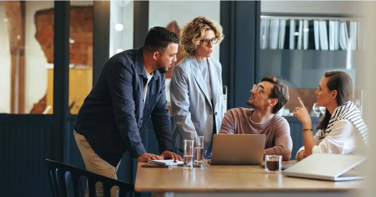 Business people having a meeting in a digital marketing agency. They are discussing a project in an office.
